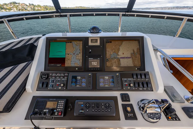 Slide: The Image of Helm of 2011 Ocean Alexander 60 Trawler with navigation screens and controls. - 58