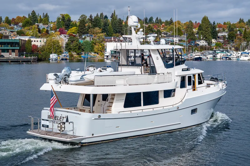 Slide: The Image of Ocean Alexander 60 Trawler 2011 cruising on a scenic waterway with lush shoreline. - 26