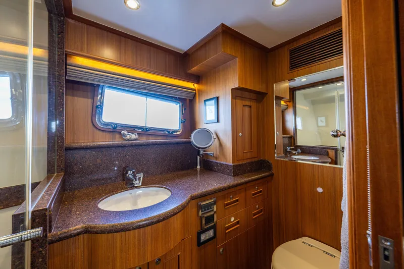 Slide: The Image of Luxurious bathroom in 2011 Ocean Alexander 60 Trawler with wood accents and modern fixtures. - 88