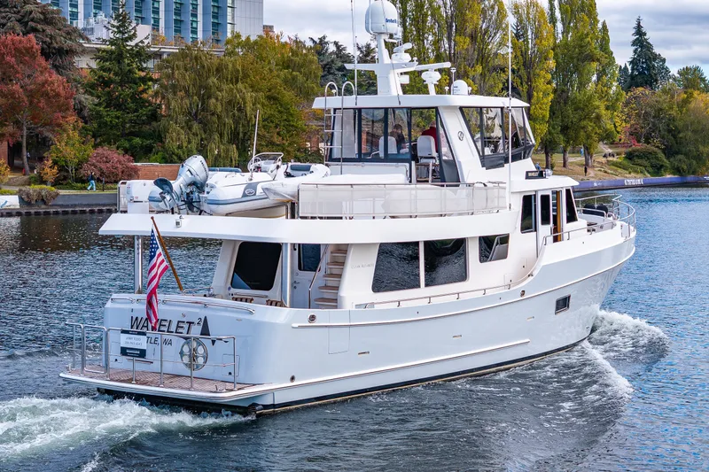 Slide: The Image of 2011 Ocean Alexander 60 Trawler cruising on a scenic waterway. - 17