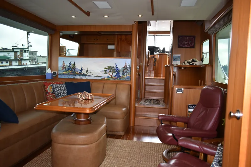 Slide: The Image of Luxurious interior of 2011 Ocean Alexander 60 Trawler with leather seating and nautical decor. - 74