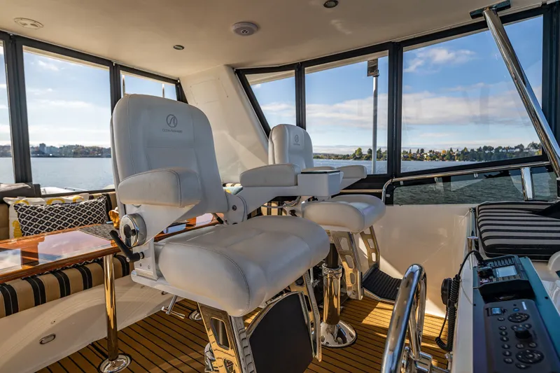 Slide: The Image of Luxurious interior of 2011 Ocean Alexander 60 Trawler with plush seating and panoramic windows. - 53