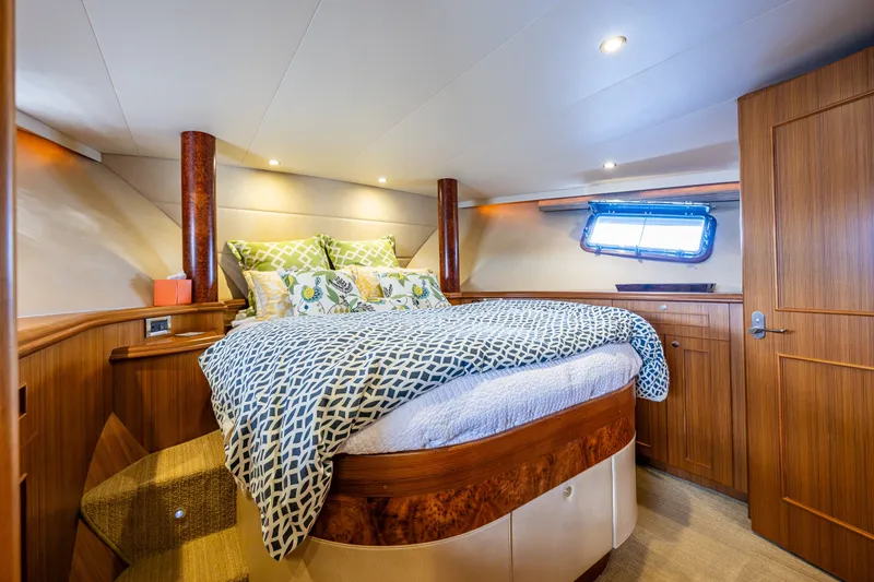 Slide: The Image of Luxurious cabin interior of 2011 Ocean Alexander 60 Trawler yacht with cozy bedding. - 94