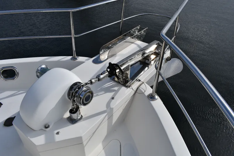 Slide: The Image of Anchor system on 2011 Ocean Alexander 60 Trawler, featuring polished metal and sturdy railings. - 126