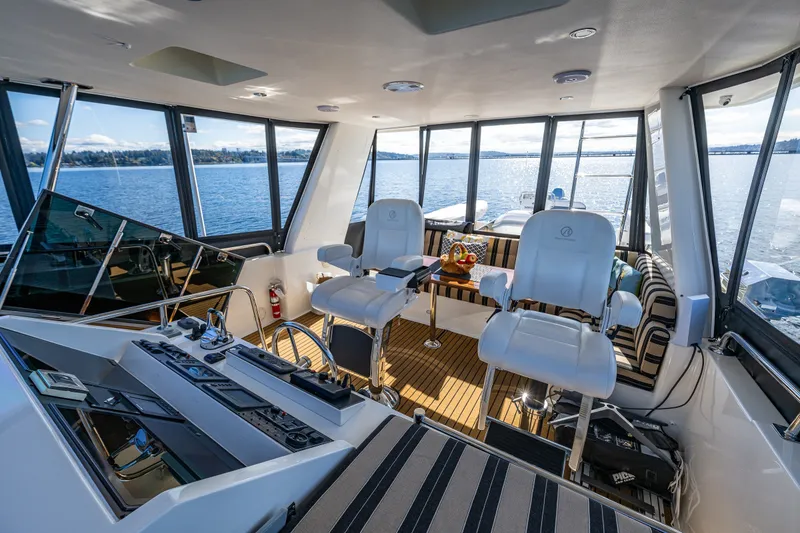 Slide: The Image of Luxurious interior of 2011 Ocean Alexander 60 Trawler with panoramic windows and plush seating. - 56