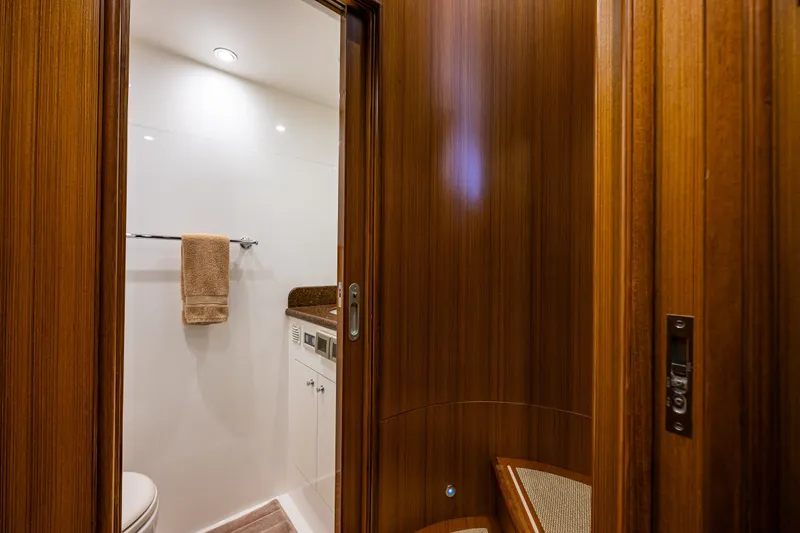 Slide: The Image of Luxurious bathroom interior on 2011 Ocean Alexander 60 Trawler yacht, featuring wood paneling. - 102
