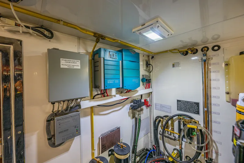 Slide: The Image of Engine room of 2011 Ocean Alexander 60 Trawler with electrical systems and wiring. - 118