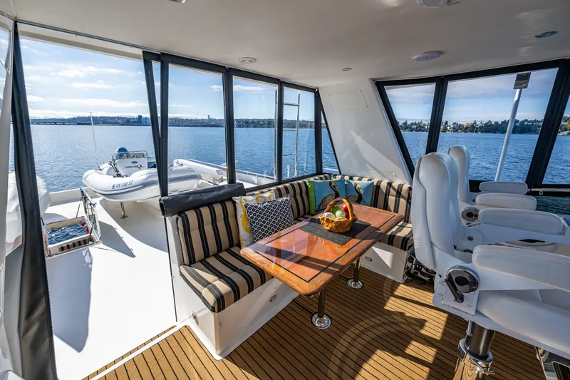 Slide: The Image of Luxurious interior of 2011 Ocean Alexander 60 Trawler with seating and scenic water views. - 51