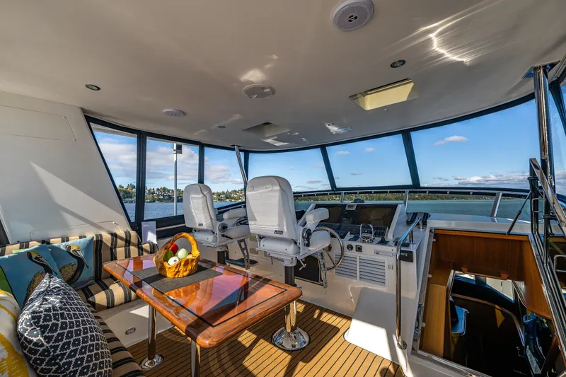 Slide: The Image of Luxurious interior of 2011 Ocean Alexander 60 Trawler with panoramic windows and elegant seating. - 55