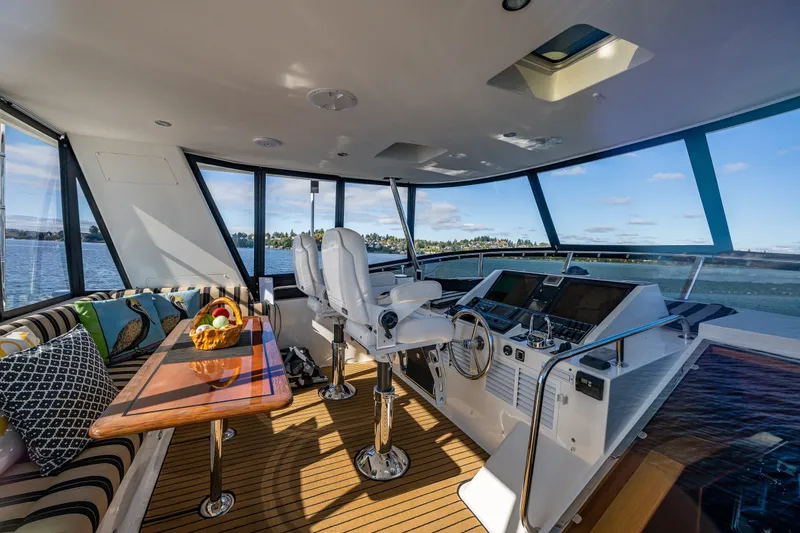 Slide: The Image of Luxurious interior of 2011 Ocean Alexander 60 Trawler with helm and seating area. - 54