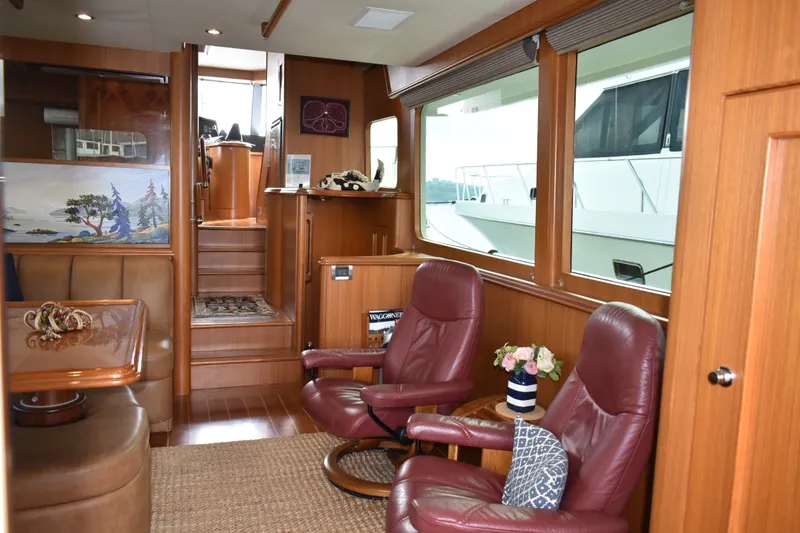 Slide: The Image of Luxurious interior of 2011 Ocean Alexander 60 Trawler with leather seating and large windows. - 76