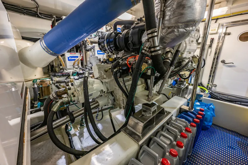 Slide: The Image of Engine room of 2011 Ocean Alexander 60 Trawler with visible machinery and components. - 120
