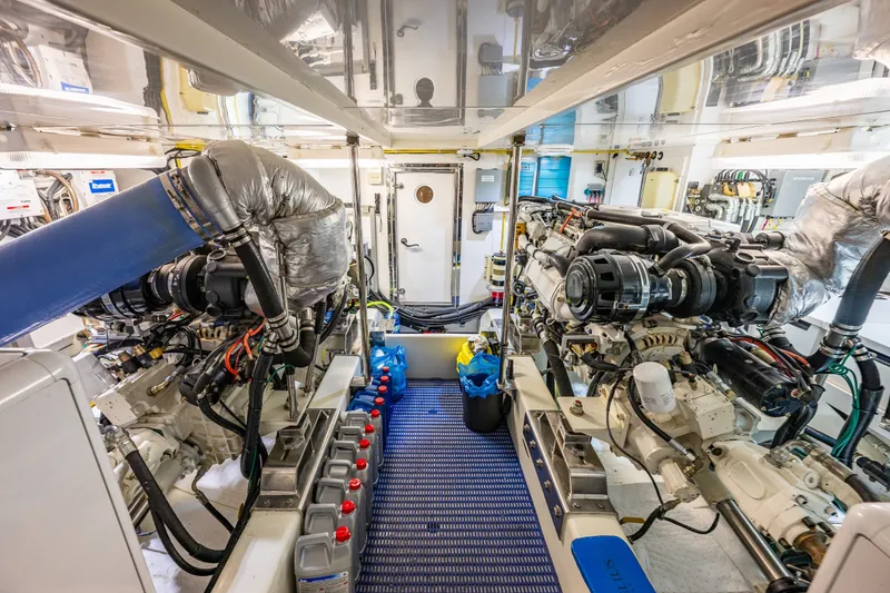 Slide: The Image of Engine room of 2011 Ocean Alexander 60 Trawler, showcasing dual engines and mechanical systems. - 108
