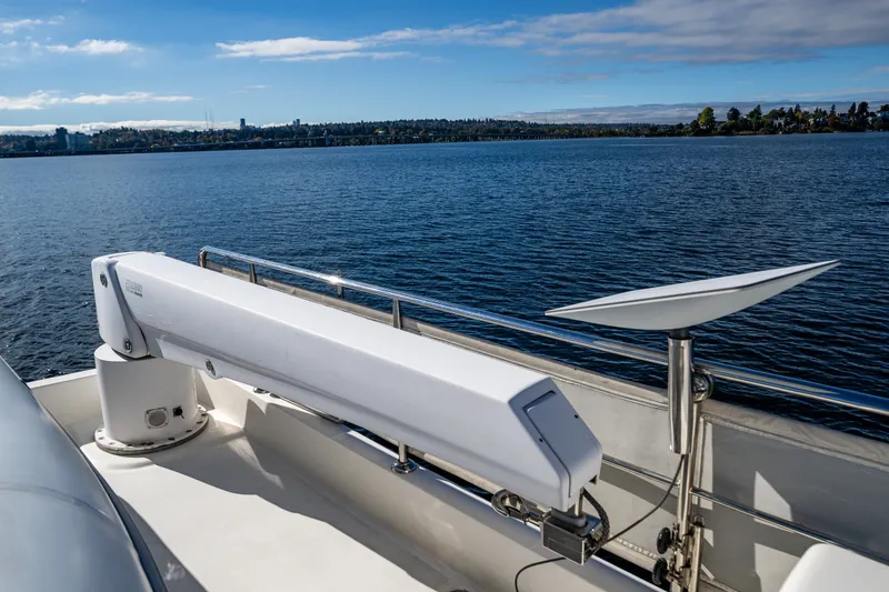 Slide: The Image of Ocean Alexander 60 Trawler 2011 on calm water with clear blue sky. - 42