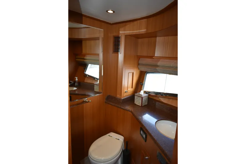 Slide: The Image of Luxurious bathroom interior of 2011 Ocean Alexander 60 Trawler with wood finish and modern amenities. - 98