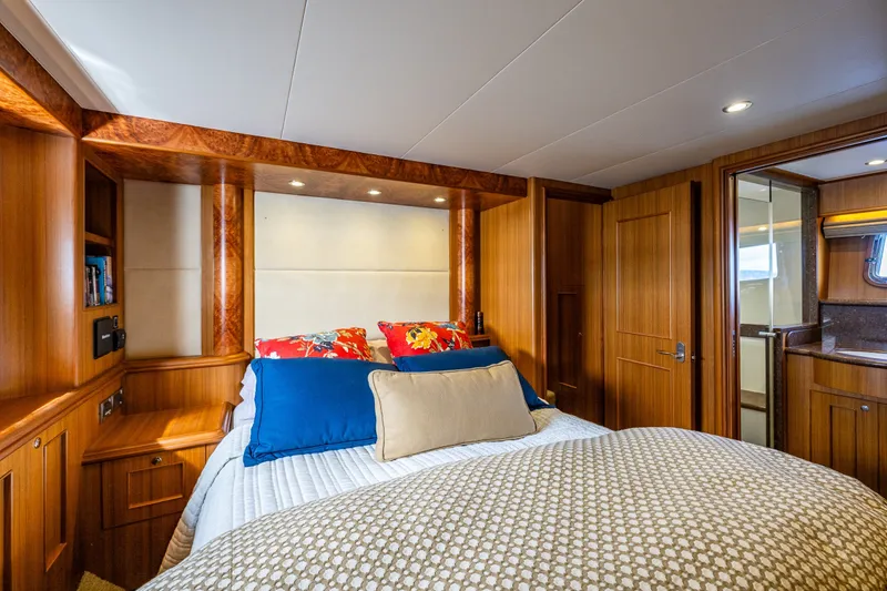 Slide: The Image of Luxurious bedroom interior of 2011 Ocean Alexander 60 Trawler yacht with wood paneling. - 85