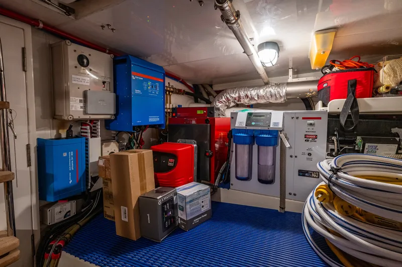 Slide: The Image of Engine room of 2011 Ocean Alexander 60 Trawler with equipment and storage. - 112