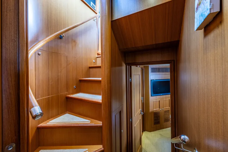 Slide: The Image of Interior of 2011 Ocean Alexander 60 Trawler with wooden staircase and hallway. - 100