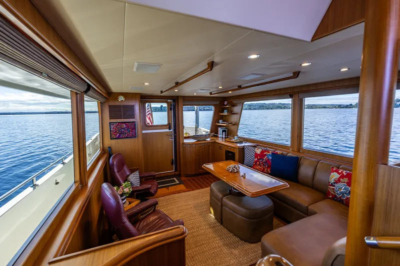 Slide: The Image of Luxurious interior of 2011 Ocean Alexander 60 Trawler with panoramic windows and elegant seating. - 69