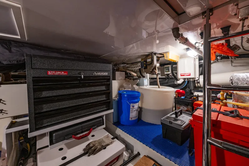 Slide: The Image of Engine room of 2011 Ocean Alexander 60 Trawler with tool chest and equipment. - 113