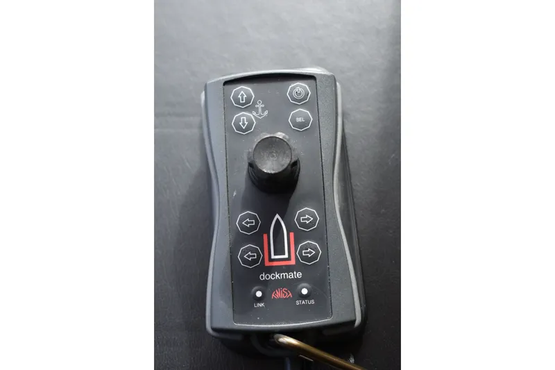 Slide: The Image of Remote control for Ocean Alexander 60 Trawler, 2011 model, featuring directional buttons and joystick. - 123