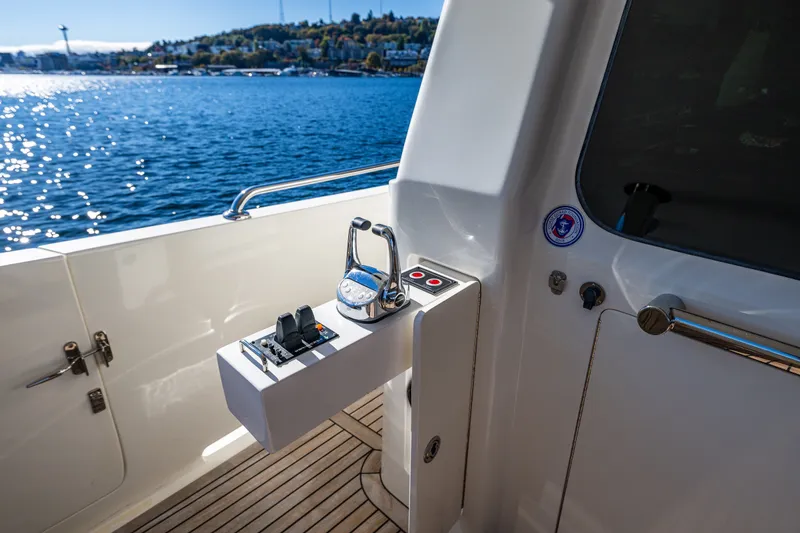 Slide: The Image of Ocean Alexander 60 Trawler 2011 yacht controls with scenic water view. - 37