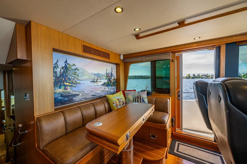 Slide: The Image of Interior of 2011 Ocean Alexander 60 Trawler with scenic artwork and leather seating. - 63