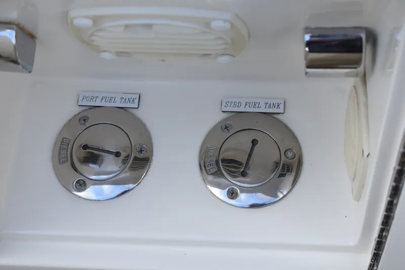 Slide: The Image of Fuel tank ports on a 2011 Ocean Alexander 60 Trawler boat. - 124