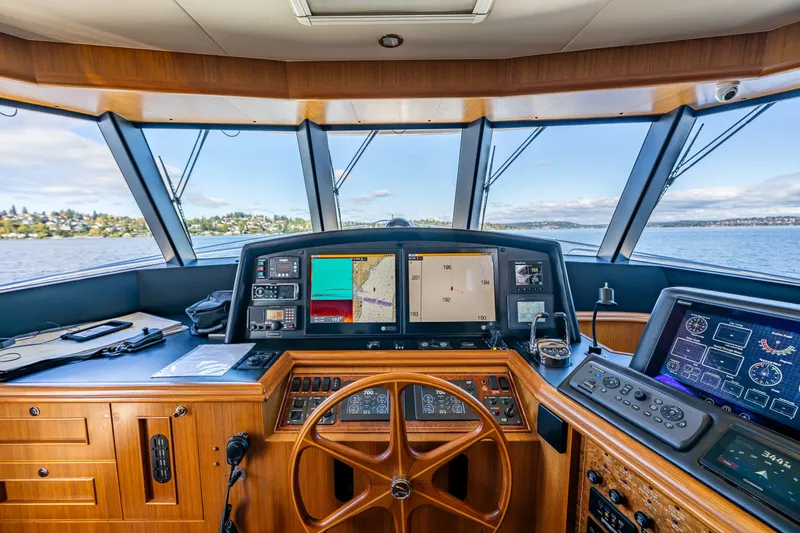 Slide: The Image of Cockpit view of 2011 Ocean Alexander 60 Trawler with navigation equipment and scenic waterway. - 66