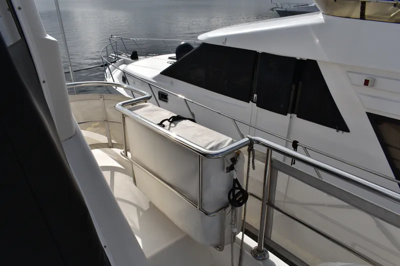 Slide: The Image of Ocean Alexander 60 Trawler 2011 yacht deck with railing and water view. - 48