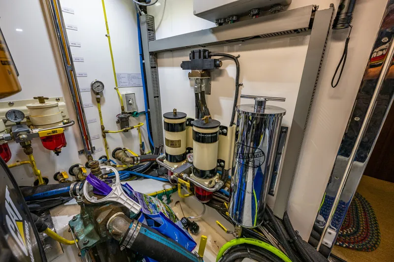 Slide: The Image of Engine room of 2011 Ocean Alexander 60 Trawler with fuel filters and gauges. - 122