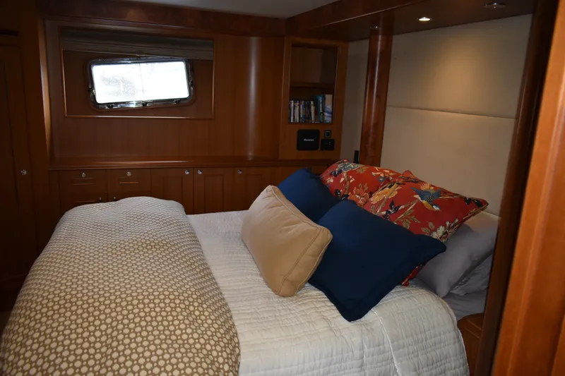 Slide: The Image of Luxurious bedroom interior of 2011 Ocean Alexander 60 Trawler with elegant bedding and wood paneling. - 84