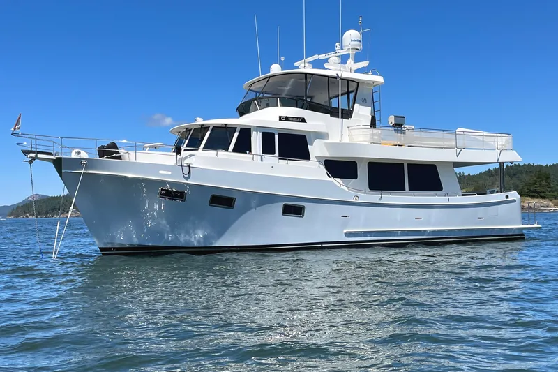 Slide: The Image of Ocean Alexander 60 Trawler 2011 yacht on calm water under clear blue sky. - 1