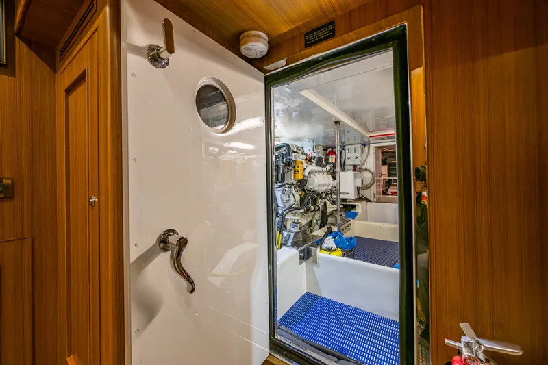 Slide: The Image of Engine room of 2011 Ocean Alexander 60 Trawler with visible machinery and equipment. - 107