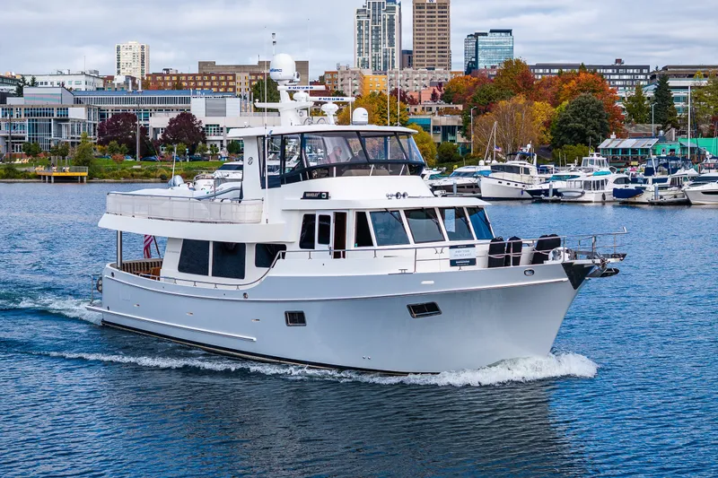 Slide: The Image of Ocean Alexander 60 Trawler 2011 cruising in a vibrant marina setting. - 27