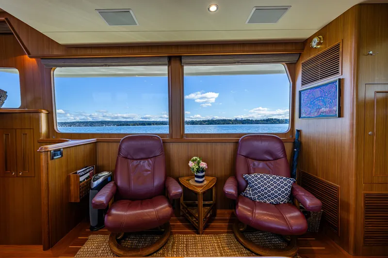 Slide: The Image of Luxurious interior of 2011 Ocean Alexander 60 Trawler with leather chairs and scenic ocean view. - 75