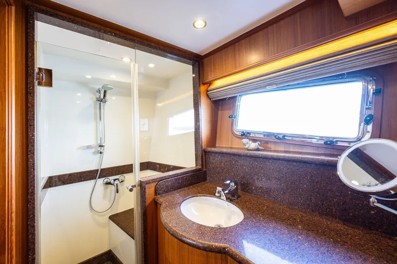 Slide: The Image of Luxurious bathroom in 2011 Ocean Alexander 60 Trawler yacht with shower and vanity. - 90