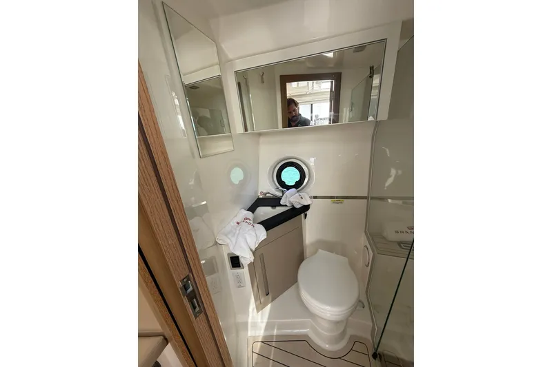 Slide: The Image of Compact bathroom in 2027 Granfort 370 GTX yacht with modern fixtures and porthole window. - 65