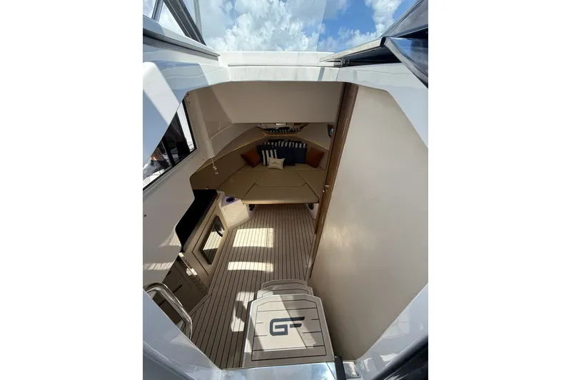 Slide: The Image of Interior view of 2027 Granfort 370 GTX yacht cabin with modern design and comfortable seating. - 53