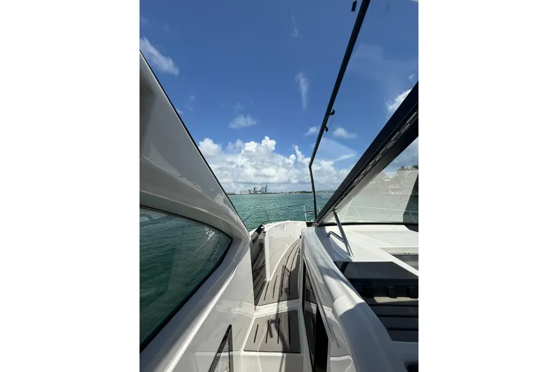 Slide: The Image of Granfort 370 GTX 2027 yacht cruising on clear blue waters under a sunny sky. - 44