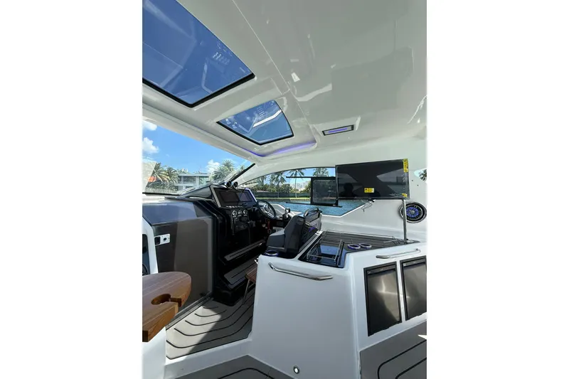 Slide: The Image of Interior of 2027 Granfort 370 GTX yacht with modern dashboard and panoramic windows. - 34