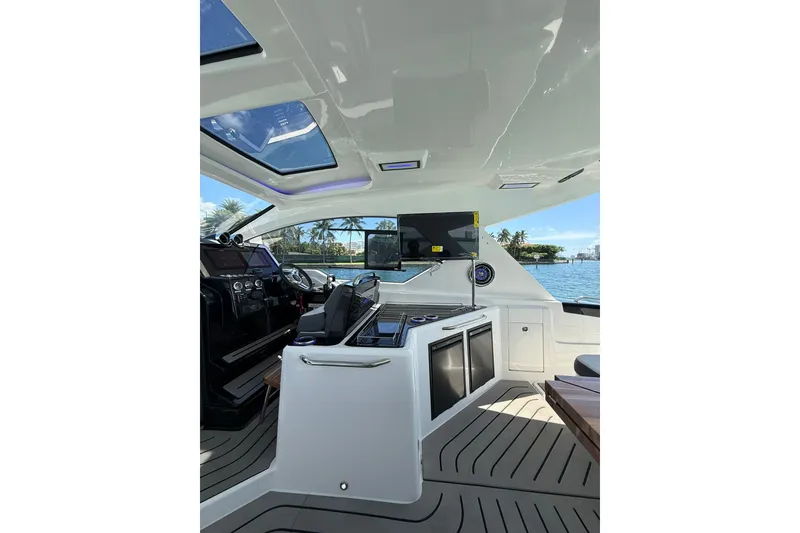 Slide: The Image of Interior of 2027 Granfort 370 GTX yacht with modern helm and panoramic windows. - 35