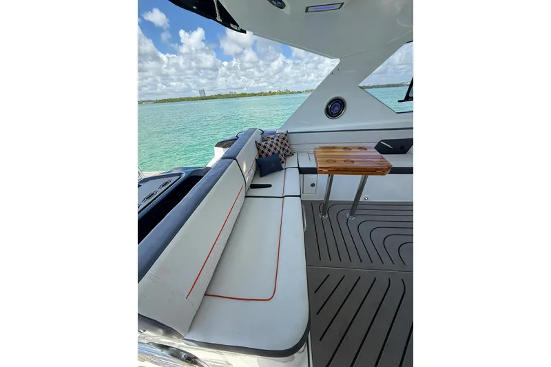 Slide: The Image of Luxurious interior of 2027 Granfort 370 GTX yacht with elegant seating and scenic ocean view. - 22