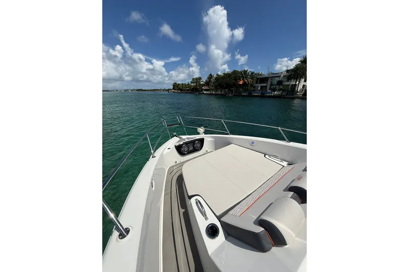 Slide: The Image of Granfort 370 GTX 2027 yacht on serene water with luxurious deck seating. - 46