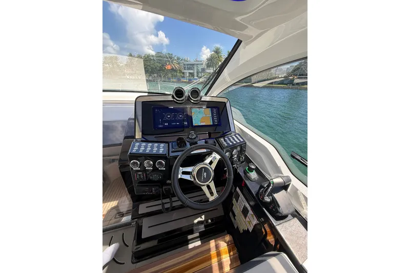 Slide: The Image of Cockpit of 2027 Granfort 370 GTX yacht with advanced navigation systems and steering wheel. - 27
