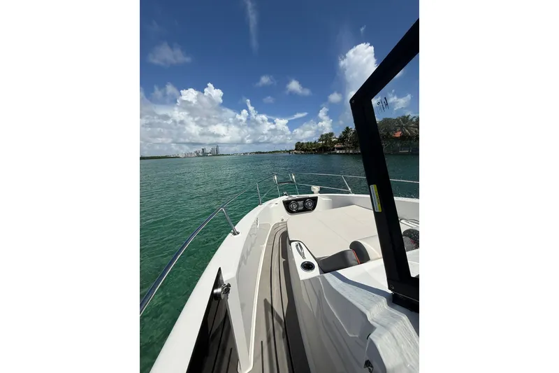 Slide: The Image of Granfort 370 GTX 2027 boat cruising on clear waters under a bright blue sky. - 45