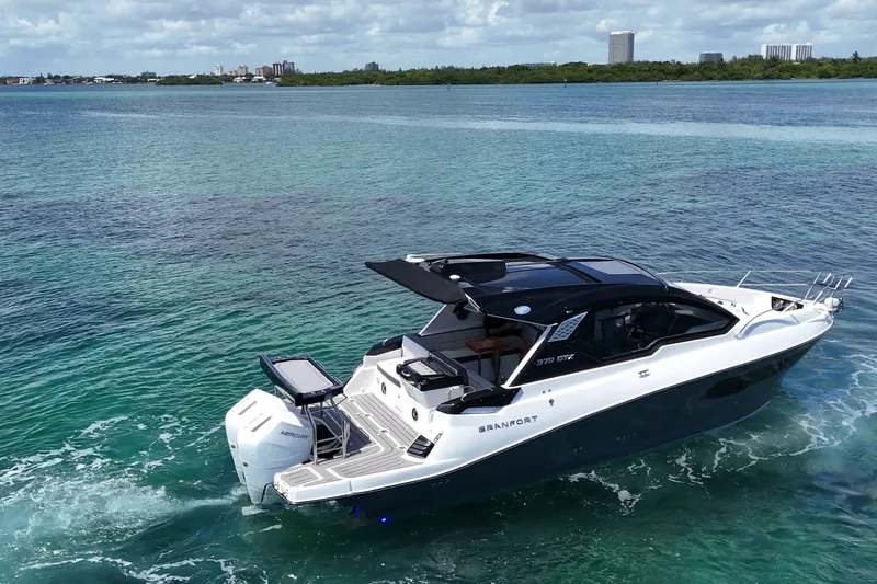 Slide: The Image of Luxury Granfort 370 GTX yacht cruising on clear blue waters, 2027 model. - 12