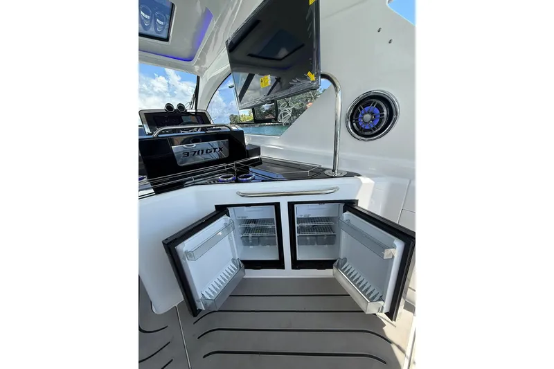Slide: The Image of Interior of 2027 Granfort 370 GTX yacht with open mini fridge and sleek design. - 39