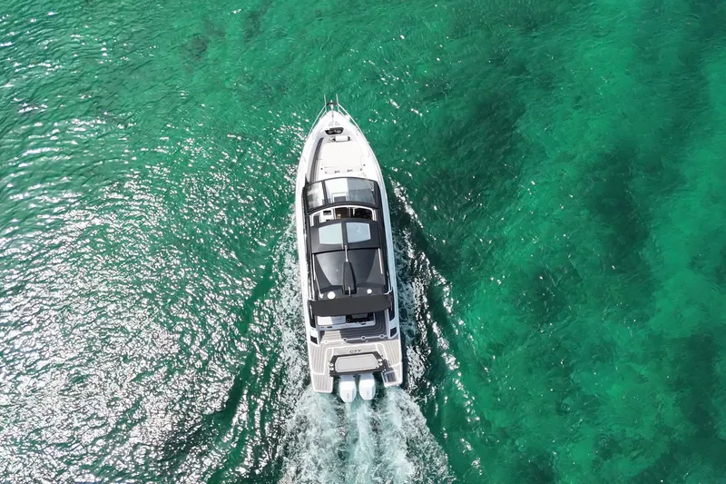 Slide: The Image of Aerial view of 2027 Granfort 370 GTX yacht cruising in clear turquoise waters. - 6
