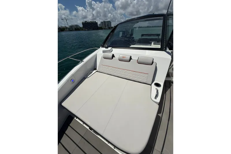 Slide: The Image of 2027 Granfort 370 GTX boat with sleek seating and modern design on the water. - 48